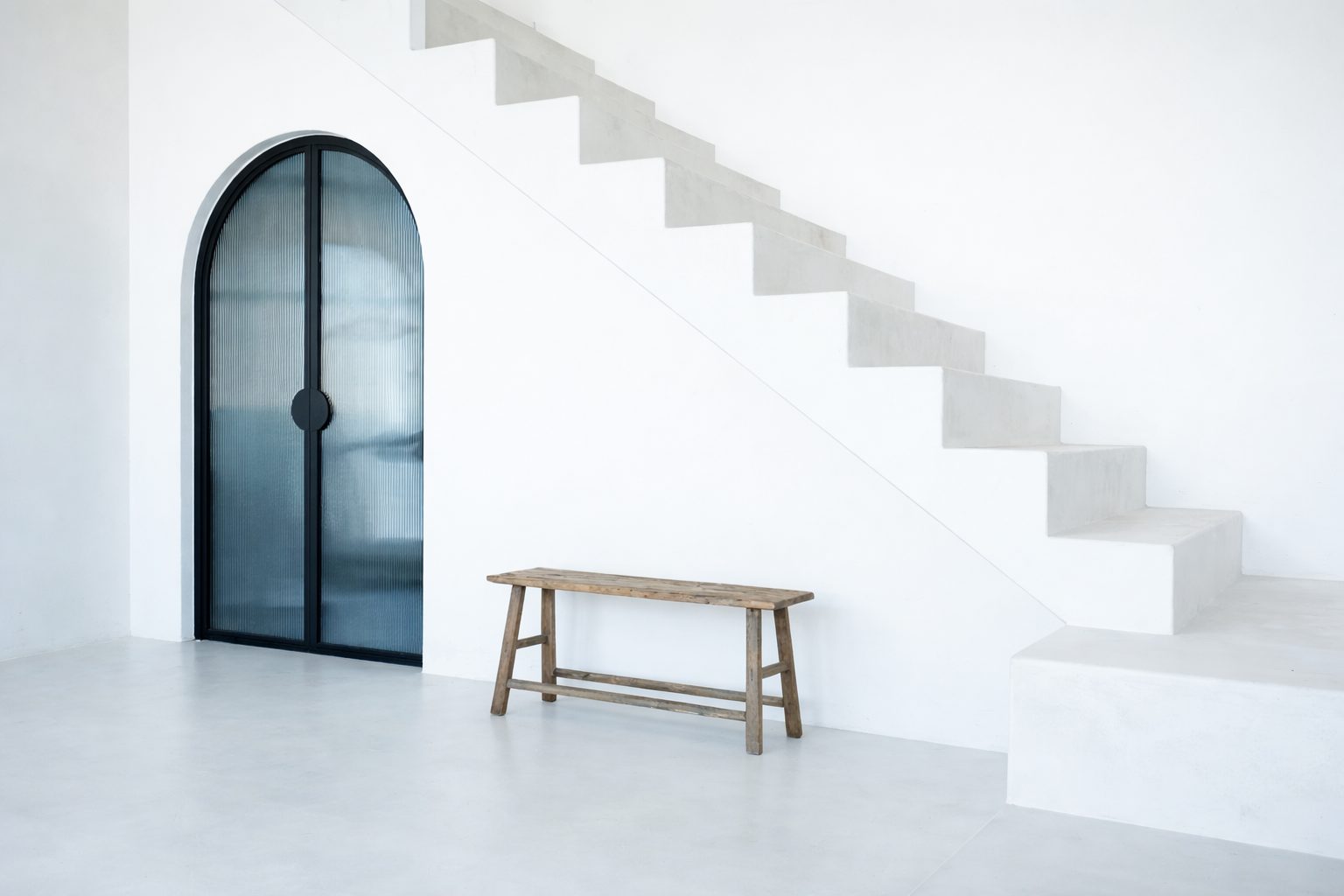 Minimal modern staircase in a Florida second home, illustrating intentional design and ease of living.